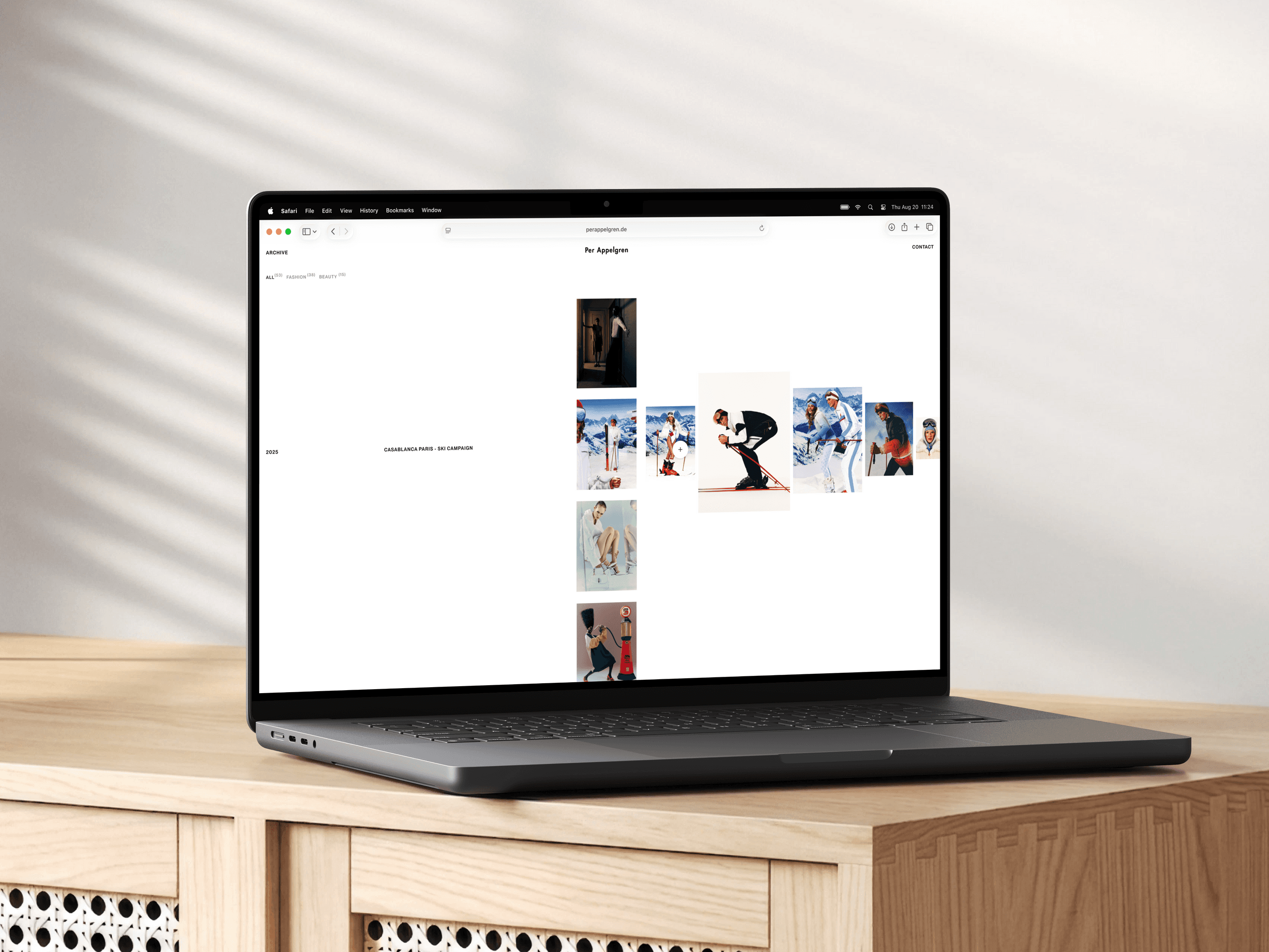 Laptop showing the portfolio archive with the Casablanca Paris ski campaign expanded into a horizontal row of images.