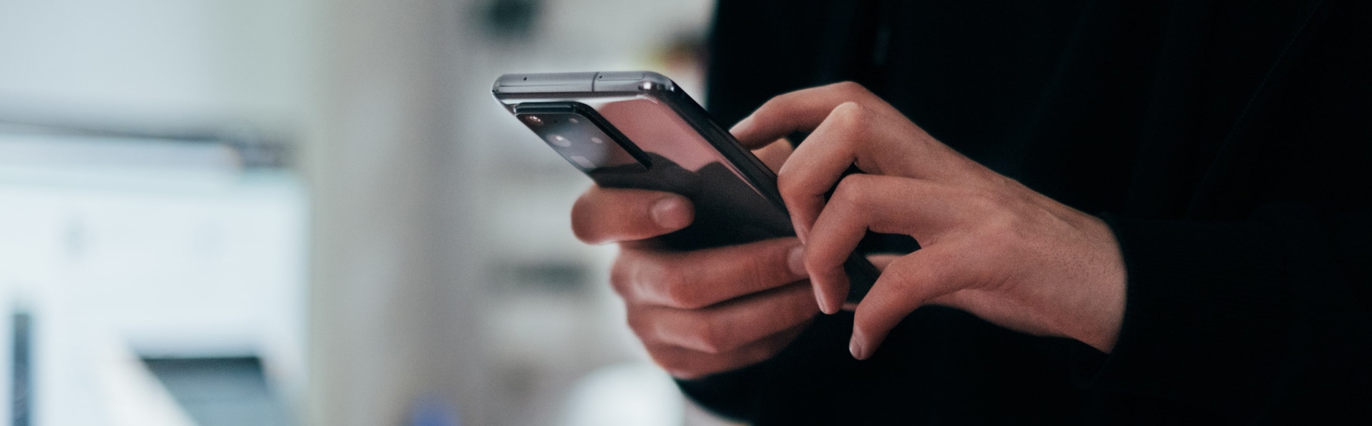 Hands holding smartphone